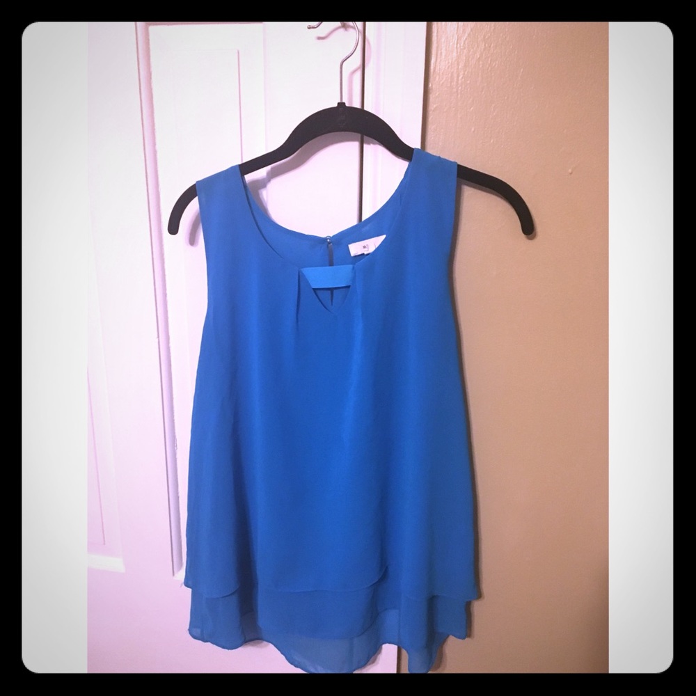 Bright blue top with tiny cut out and detailing